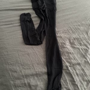 Black worn pantyhose laid flat after 24 hours – sheer nylon fetish item